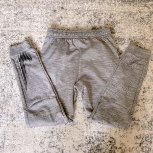 nike gray athletic joggers with black logo